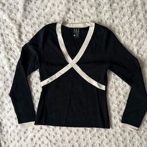 Long sleeve black top with white accents